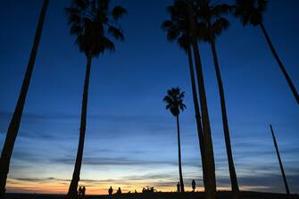 LOS ANGELES, CALIFORNIA - DECEMBER 10: People enjoy at the Venice Beach during sunset as daily life in Pacific coastline of Los Angeles, California, United States on December 10, 2023. (Photo by Tayfun Coskun/Anadolu via Getty Images)