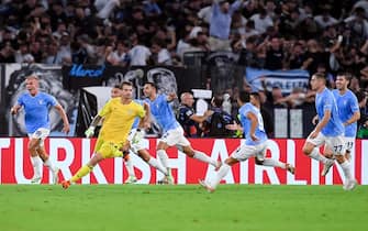 Ivan Provedel of SS Lazio celebrates with teammates after scoring the team's first goal to equalise  during the UEFA Champions League Group E match between SS Lazio v Atletico de Madrid at Stadio Olimpico Roma on September 19, 2023 in Rome, Italy. (Photo by Giuseppe Maffia/NurPhoto via Getty Images)