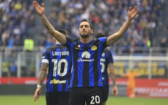 MILAN, ITALY - APRIL 28: Hakan Calhanoglu of FC Internazionale celebrates after scoring the his team's second goal during the Serie A TIM match between FC Internazionale and Torino FC at Stadio Giuseppe Meazza on April 28, 2024 in Milan, Italy. (Photo by Giuseppe Cottini/Getty Images)