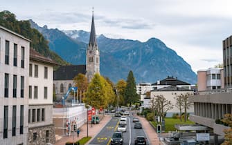 Vaduz, Liechtenstein - Main city street with St. Florin Cathedral in the background