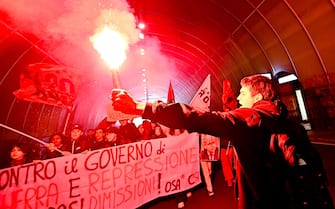 Protestors during a rally held next to Prefecture of Genoa to contest ministers Matteo Piantedosi and Matteo Salvini after Pisa clashes in Genoa, Italy, 4 March 2024. ANSA/SIMONE ARVEDA