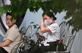 A relative of a victim of a large apartment fire cries at a hospital in Hanoi on May 24, 2024. A fire that ripped through a small apartment complex in central Hanoi early May 24 has killed at least 14 people and injured three others, police said. (Photo by AFP) (Photo by STR/AFP via Getty Images)