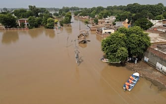 TOPSHOT - This photograph shows an aerial view of the flooded Chanda Singh Wala village in Kasur district on August 22, 2023. Around 100,000 people have been evacuated from flooded villages in Pakistan's Punjab province, an emergency services representative said on August 23. (Photo by Arif ALI / AFP) (Photo by ARIF ALI/AFP via Getty Images)