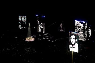 RIO DE JANEIRO, BRAZIL - MAY 04: American singer Madonna performs the song "Live to Tell" while giant screens show pictures of people who died as a result of AIDS during her massive free show to close "The Celebration Tour" at Copacabana Beach on May 04, 2024 in Rio de Janeiro, Brazil. (Photo by Buda Mendes/Getty Images)