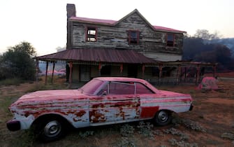 SANTA CLARITA, CA - JULY 24, 2016: Several buildings and cars were drenched in Phos-Chek, a pink fire retardants at the Sable Ranch was burned in the Sand Fire, off of Sand Canyon Rd, in Santa Clarita, CA July 24, 2016. The ranch is used varies movie and TV productions. Several of the sets were destroyed in the fire. (Francine Orr/ Los Angeles Times)