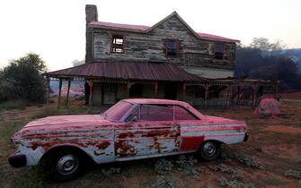 Los Angeles SANTA CLARITA, CA - JULY 24, 2016: Several buildings and cars were drenched in Phos-Chek, a pink fire retardants at the Sable Ranch was burned in the Sand Fire, off of Sand Canyon Rd, in Santa Clarita, CA July 24, 2016. The ranch is used varies movie and TV productions. Several of the sets were destroyed in the fire. (Francine Orr/ Los Angeles Times)