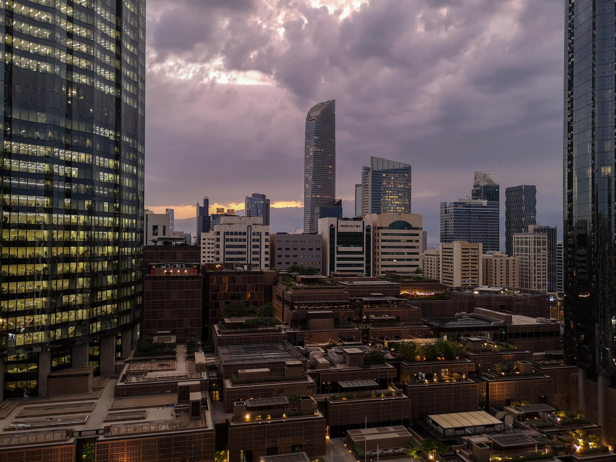 View of Abu Dhabi city towers and buildings - storm clouds