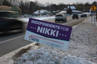 MANCHESTER, NEW HAMPSHIRE - JANUARY 18: A campaign signed urging independents to vote for Republican presidential candidate and former UN Ambassador Nikki Haley is stuck in the snow on January 18, 2024, in Portsmouth, New Hampshire.  The state's Republican primary is scheduled for January 23, 2024. (Photo by Joe Raedle/Getty Images)