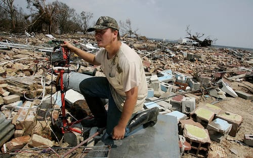 COVINGTON, CA - SEPTEMBER 04:  Kelvin Schulz II looks for anything that could be left in whats left of his family home that his grandmother Jane Mollere,80, was last seen alive on Washington St. in Bay St. Louis ,Mississippi when his family tried to ride out the storm during the aftermath of Hurricane Katrina that has destroyed New Orleans, Louisiana and parts of Mississippi September 5. 2005. (Photo by Keith Birmingham/MediaNews Group/Pasadena Star-News via Getty Images)"n