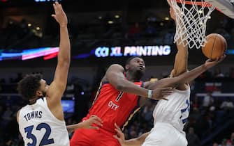 NEW ORLEANS, LOUISIANA - DECEMBER 11: Zion Williamson #1 of the New Orleans Pelicans shoots against Karl-Anthony Towns #32 of the Minnesota Timberwolves  during the second half at the Smoothie King Center on December 11, 2023 in New Orleans, Louisiana. NOTE TO USER: User expressly acknowledges and agrees that, by downloading and or using this Photograph, user is consenting to the terms and conditions of the Getty Images License Agreement. (Photo by Jonathan Bachman/Getty Images)