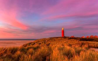 Texel Lighthouse and small village on the north point of the island of Texel near De Cocksdorp