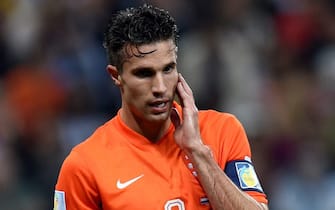 epa04308344 Robin van Persie of the Netherlands reacts during the FIFA World Cup 2014 semi final match between the Netherlands and Argentina at the Arena Corinthians in Sao Paulo, Brazil, 09 July 2014. 

(RESTRICTIONS APPLY: Editorial Use Only, not used in association with any commercial entity - Images must not be used in any form of alert service or push service of any kind including via mobile alert services, downloads to mobile devices or MMS messaging - Images must appear as still images and must not emulate match action video footage - No alteration is made to, and no text or image is superimposed over, any published image which: (a) intentionally obscures or removes a sponsor identification image; or (b) adds or overlays the commercial identification of any third party which is not officially associated with the FIFA World Cup)  EPA/MARIUS BECKER   EDITORIAL USE ONLY