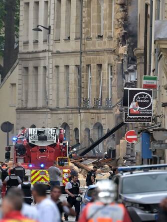 French firefighters put out a fire after a building partly collapsed at Place Alphonse-Laveran in the 5th arrondissement of Paris, on June 21, 2023. A major fire broke out on June 21, 2023 in a building in central Paris, part of which collapsed, according to images taken by AFP journalists. (Photo by Alain JOCARD / AFP) (Photo by ALAIN JOCARD/AFP via Getty Images)