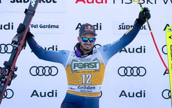 Winner Dominik Paris of Italy celebrates on the podium for the Men's Downhill race at the FIS Alpine Skiing World Cup in Val Gardena, Italy, 16 December 2023. ANSA/LUCIANO SOLERO