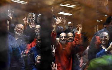 epa04802469 Muslim Brotherhood Supreme Guide Mohammed Badie (C, wearing red) along other Brotherhood members react inside defendants' cage in the courtroom during a trial session, in Cairo, Egypt, 16 June 2015.  A Cairo court on 16 June 2015 sentenced former president Mohamed Morsi to death over jailbreaks during Egypt's 2011 uprising. Muslim Brotherhood Supreme Guide Mohammed Badie, former parliament speaker Saad al-Katatni and three other co-defendants also received the death penalty in the case. In a related case, three Muslim Brotherhood leaders were sentenced to hang for conspiring with foreign powers. Morsi and 16 others received life sentences in that case.  EPA/ALI MALKI / ALMASRY ALYOUM   EGYPT OUT