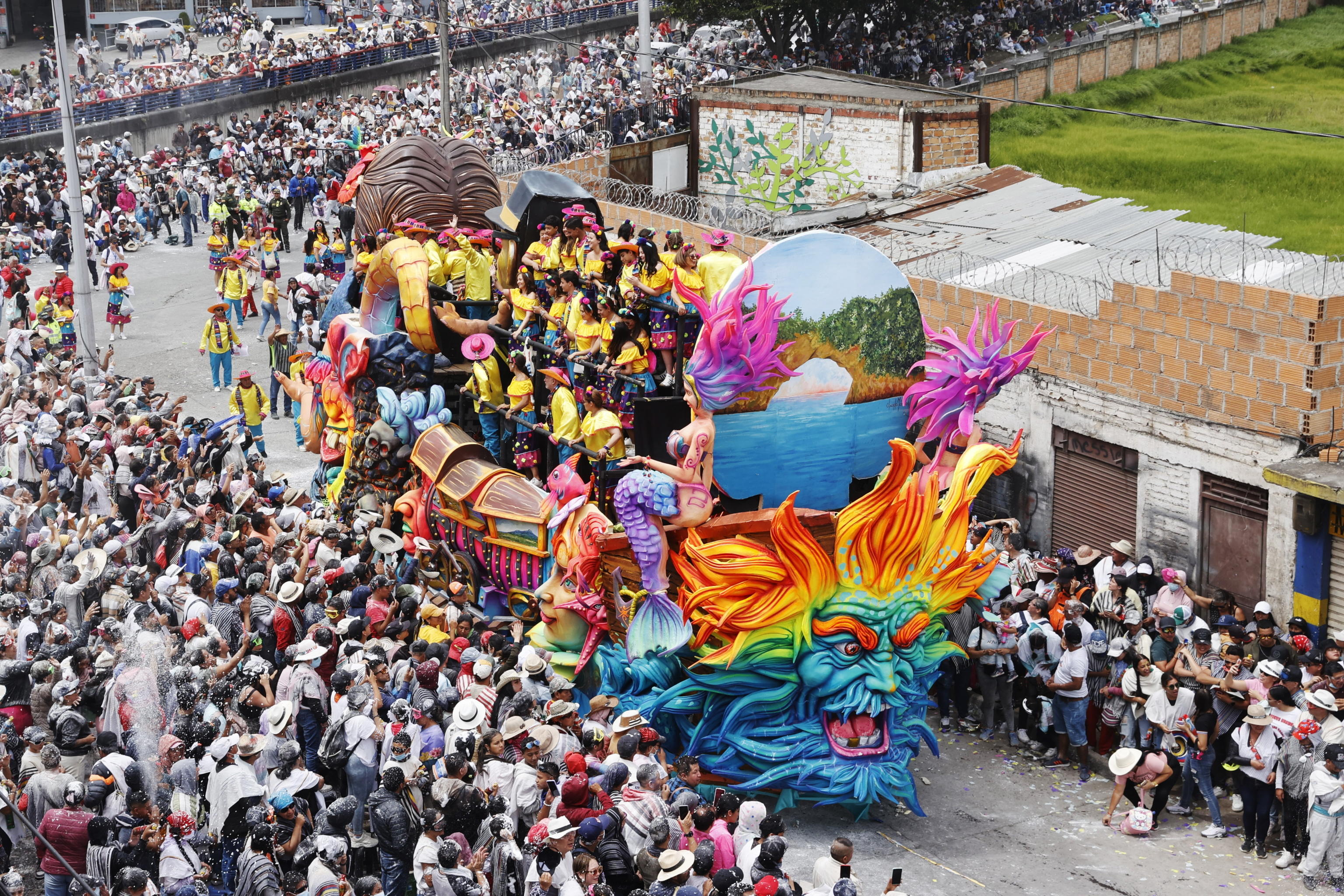 epa11061580 Participants wave from a float during the Great Parade of the Blacks and Whites' Carnival in Pasto, Colombia, 06 January 2024. The city of Pasto kicked off the year with its traditional Blacks and Whites Carnival. The annual event is recognized as an Intangible Cultural Heritage of Humanity by UNESCO. This year's festivities take place between 02 and 08 January.  EPA/Mauricio Duenas Castaneda