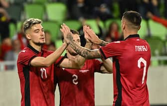 Albanian defender #17 Ernest Muci (R) celebrates scoring his team's second goal with his team mates during the friendly football match between Albania and Liechtenstein in the local stadium of Szombathely, Hungary, on June 03, 2024. (Photo by Attila KISBENEDEK / AFP)