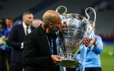 ISTANBUL, TURKEY - JUNE 10:  Manchester City manager Pep Guardiola kisses the trophy after the UEFA Champions League 2022/23 final match between FC Internazionale and Manchester City FC at Atatuerk Olympic Stadium on June 10, 2023 in Istanbul, Turkey. (Photo by Craig Mercer/MB Media/Getty Images)