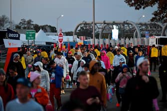 Runners arrive ahead of the 52nd Edition of the New York City Marathon on November 5, 2023. (Photo by ANGELA WEISS / AFP)