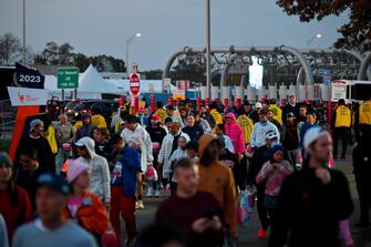 Runners arrive ahead of the 52nd Edition of the New York City Marathon on November 5, 2023. (Photo by ANGELA WEISS / AFP)