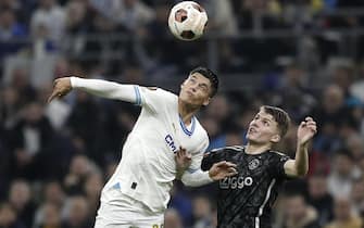 epa11004390 Joaquin Correa (L) of Marseille and Anton Gaaei (R) of Ajax in action during the UEFA Europa League group B match between Olympique Marseille and Ajax Amsterdam in Marseille, France, 30 November 2023.  EPA/GUILLAUME HORCAJUELO