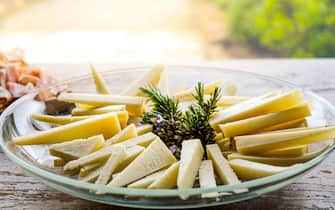 cheese wedges on a plate slices of pecorino