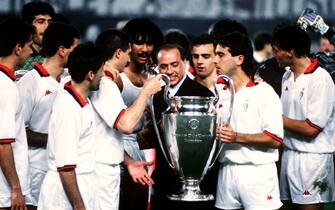 AC Milan Team with Silvio Berlusconi celebrate with the cup  (Photo by Peter Robinson/EMPICS via Getty Images)