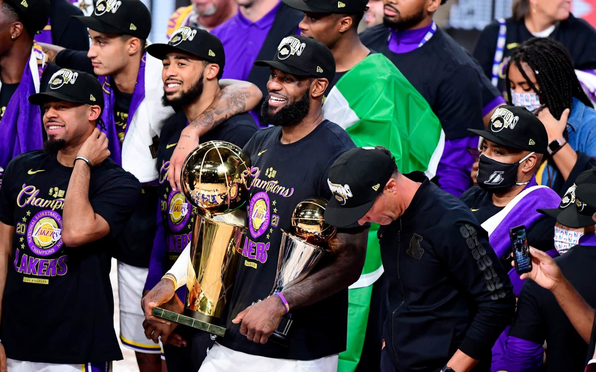 LAKE BUENA VISTA, FLORIDA - OCTOBER 11: LeBron James #23 of the Los Angeles Lakers reacts with his MVP trophy and Finals trophy after winning the 2020 NBA Championship over the Miami Heat in Game Six of the 2020 NBA Finals at AdventHealth Arena at the ESPN Wide World Of Sports Complex on October 11, 2020 in Lake Buena Vista, Florida. NOTE TO USER: User expressly acknowledges and agrees that, by downloading and or using this photograph, User is consenting to the terms and conditions of the Getty Images License Agreement.  (Photo by Douglas P. DeFelice/Getty Images)