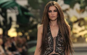 French model Laetitia Casta displays a creation as part of Roberto Cavalli spring-summer 2011 ready-to-wear collection on September 27, 2010 during the Women's fashion week in Milan.    AFP PHOTO / OLIVIER MORIN (Photo credit should read OLIVIER MORIN/AFP via Getty Images)