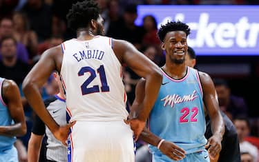 MIAMI, FLORIDA - DECEMBER 28:  Jimmy Butler #22 of the Miami Heat laughs after being fouled by Joel Embiid #21 of the Philadelphia 76ers during the second half at American Airlines Arena on December 28, 2019 in Miami, Florida. NOTE TO USER: User expressly acknowledges and agrees that, by downloading and/or using this photograph, user is consenting to the terms and conditions of the Getty Images License Agreement. (Photo by Michael Reaves/Getty Images)