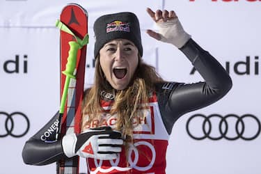 epa10369769 Sofia Goggia of Italy celebrates on the podium after winning the women's Downhill race at the FIS Alpine Skiing World Cup in St. Moritz, Switzerland, 17 December 2022.  EPA/PETER SCHNEIDER