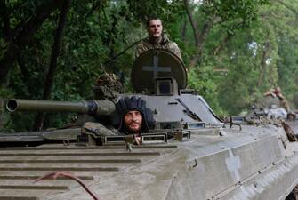 epa10722097 Ukrainian servicemen from the 3rd Separate Assault Brigade ride an armoured personnel carrier (APC) at a road near the frontline city of Bakhmut, Donetsk region, eastern Ukraine, 01 July 2023 (issued 02 July 2023), amid the Russian invasion. The frontline city of Bakhmut, a key target for Russian forces, has seen heavy fighting for months. Russian troops entered Ukrainian territory in February 2022, starting a conflict that has provoked destruction and a humanitarian crisis.  EPA/ALEX BABENKO