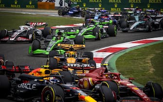 SHANGHAI INTERNATIONAL CIRCUIT, CHINA - APRIL 20: Sergio Perez, Red Bull Racing RB20, leads Carlos Sainz, Ferrari SF-24, Lando Norris, McLaren MCL38, Valtteri Bottas, Kick Sauber F1 Team C44, Kevin Magnussen, Haas VF-24, and the remainder of the field on the opening lap of the Sprint during the Chinese GP at Shanghai International Circuit on Saturday April 20, 2024 in Shanghai, China. (Photo by Sam Bloxham / LAT Images)