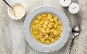 Tortellini in beef and chicken broth. Egg pasta originally from the Italian region of Emilia, Bologna. Stuffed with a mix of meat, prosciutto, mortadella, hard cheese, egg and served in capon broth.