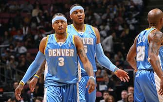 EAST RUTHERFORD, NJ - MARCH 21: Allen Iverson #3 and Carmelo Anthony #15 of the Denver Nuggets walk toward the foul-line during the game against the New Jersey Nets on March 21, 2008 at the Izod Center in East Rutherford, New Jersey. NOTE TO USER: User expressly acknowledges and agrees that, by downloading and or using this Photograph, user is consenting to the terms and conditions of the Getty Images License Agreement. Mandatory Copyright Notice: Copyright 2008 NBAE (Photo by Jesse D. Garrabrant/NBAE via Getty Images)