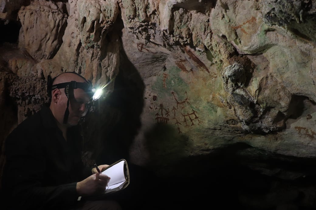 Professor Maxime Aubert working in the cave