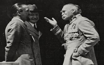 Dino Grandi (1895-1988), left, Italian Minister of Foreign Affairs, visits Polish Marshal and politician Jozef Pilsudski (1867-1935), center, on June 11 in the vicinity of Warsaw, Poland, photo by Swiatowid, from L'Illustrazione Italiana, year LVII, n 25, June 22, 1930.