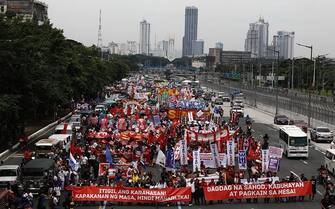 epa10765334 Activists mach during a protest rally along a road leading to the Congress compound in Quezon city, Metro Manila, Philippines, 24 July 2023. The protesters gathered against the State of the Nation Address (SONA) of President Ferdinand 'Bongbong' Marcos.  EPA/FRANCIS R. MALASIG