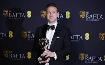 epa11901693 British cinematographer Lol Crawley poses in the press room after winning the Cinematography award for 'The Brutalist' during the BAFTA Film Awards at the Royal Festival Hall in London, Britain, 16 February 2025. The ceremony is hosted by the British Academy of Film and Television Arts (BAFTA).  EPA/TOLGA AKMEN