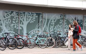 Bicycles outside the glass facade of Solvgades School in Copenhagen