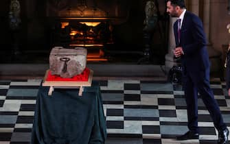Scotland's First Minister Humza Yousaf looks at the Stone of Destiny during a special ceremony at Edinburgh Castle on April 27, 2023 before it is transported to Westminster Abbey for the Coronation of Britain's King Charles III. - The Stone of Destiny, a sacred slab of sandstone that became a symbol of Scottish nationhood, left Edinburgh Castle for London, where it will play a key role in King Charles III's coronation. The 152-kilogram (335-pound) stone, seized from the Scots by the king of England Edward I in 1296, is being taken to Westminster Abbey in London for the May 6 ceremony. (Photo by RUSSELL CHEYNE / POOL / AFP) (Photo by RUSSELL CHEYNE/POOL/AFP via Getty Images)