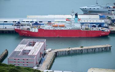 The Bibby Stockholm accommodation barge is pictured moored to the quayside at Portland Port in Portland, on the south-west coast of England on August 8, 2023. Britain on Monday began housing migrants on board a barge docked off the south-west English coast, in its latest controversial immigration policy that has drawn heavy criticism from locals and rights campaigners. (Photo by Ben Stansall / AFP) (Photo by BEN STANSALL/AFP via Getty Images)