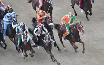 The monkey of Contranda of Lupa  named  Dino Pes    of nickname Velluto on  Benitos  wins the historical Italian horse race Palio di Siena, in Siena, Italy, 17 August 2024. The traditional horse race takes place on 17 August as the 'Palio dell'Assunta' during the holidays for the Assumption of Mary.
ANSA/CLAUDIO GIOVANNINI