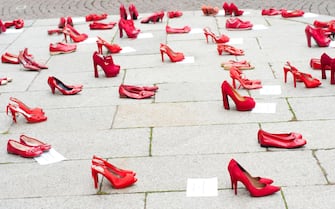 Italy, Lombardy, Exposed Red Shoes Along the Street Symbolized Rebellion Against Violence to Women