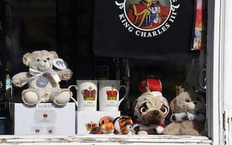 King Charles III and coronation merchandise on display in a shop window near to Windsor Castle in Windsor, Berkshire. Preparations are underway across the UK for the coronation on May 6. Picture date: Thursday April 13, 2023.