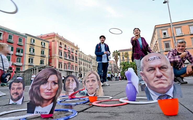 The games set up in Piazza Dante by the "Youth Against Meloni" protagonists of protest initiatives against the new Italian Government, in Naples, Italy, 24 October 2022. In the small "Luna Park" there is also "Catch the Minister" game with the faces of Meloni and Ministers glued on pins to be centered with rings.     ANSA / CIRO FUSCO