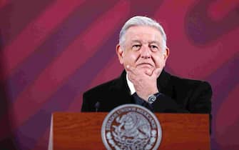 epa11039976 Mexican President Andres Manuel Lopez Obrador gestures as he speaks during his morning press conference at the National Palace in Mexico City, Mexico, 21 December 2023. Lopez Obrador revealed that he will speak by phone with US President Joe Biden on 21 December, to address issues related to migration.  EPA/SASHENKA GUTIERREZ