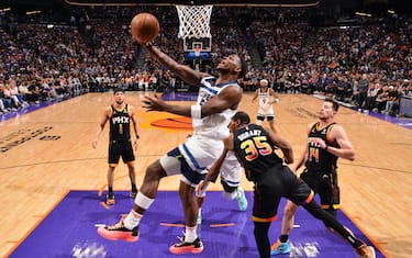 PHOENIX, AZ - APRIL 26:  Anthony Edwards #5 of the Minnesota Timberwolves drives to the basket during the game against the Phoenix Suns during Round 1 Game 3 of the 2024 NBA Playoffs on April 26, 2024 at Footprint Center in Phoenix, Arizona. NOTE TO USER: User expressly acknowledges and agrees that, by downloading and or using this photograph, user is consenting to the terms and conditions of the Getty Images License Agreement. Mandatory Copyright Notice: Copyright 2024 NBAE (Photo by Barry Gossage/NBAE via Getty Images)