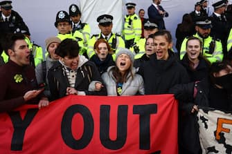 Swedish climate activist Greta Thunberg shouts slogans with fellow protesters outside the InterContinental London Park Lane during the "Oily Money Out" demonstration organised by Fossil Free London and Greenpeace on the sidelines of the opening day of the Energy Intelligence Forum 2023 in London on October 17, 2023. (Photo by HENRY NICHOLLS / AFP) (Photo by HENRY NICHOLLS/AFP via Getty Images)