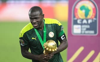 Senegal's defender Kalidou Koulibaly holds the trophy after winning the Africa Cup of Nations (CAN) 2021 final football match between Senegal and Egypt at Stade d'Olembe in Yaounde on February 6, 2022. (Photo by Kenzo TRIBOUILLARD / AFP) (Photo by KENZO TRIBOUILLARD/AFP via Getty Images)